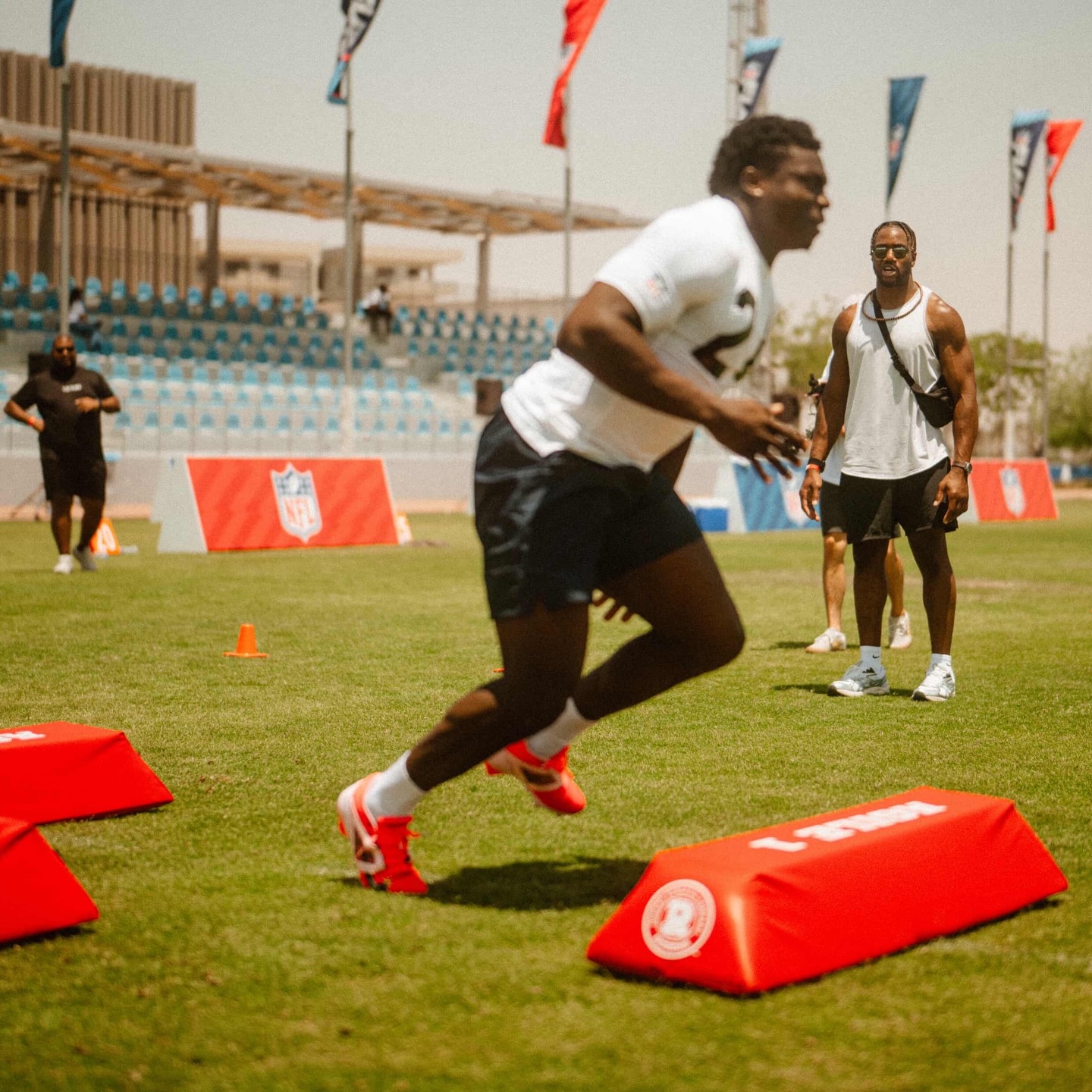 NAFO athletes running drills at an outreach camp